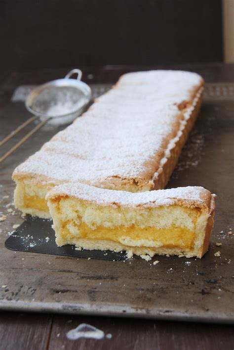 Think of it as a boozy lemon icebox cake with whipped cream! Lemon Pastry Cream Tart with Lady Fingers Topping