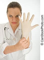 Doctor Putting A Latex Glove On Female Doctor Is Putting A Latex Glove