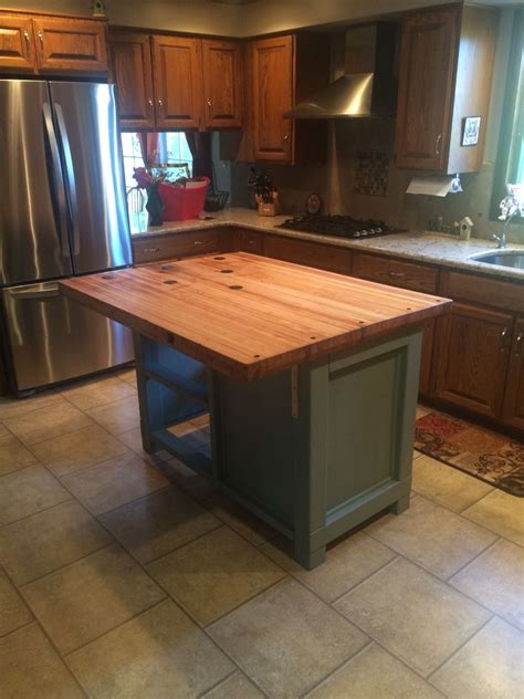 A contrasting kitchen island allows you to introduce new color and texture to the room in an understated yet impactful way. Farmhouse island | Kitchen tops, Farmhouse kitchen island ...