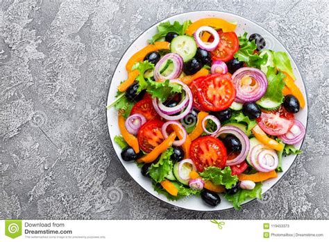 Fresh Vegetable Salad With Tomato Onion Cucumbers Pepper Olives