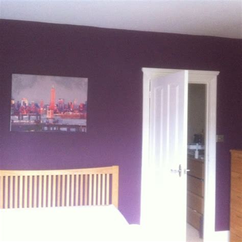 The slick black of this bedroom's cabinets is an easy way to ground a large, airy space. Mulberry burst - bedroom decorated. #dulux | Accent walls ...