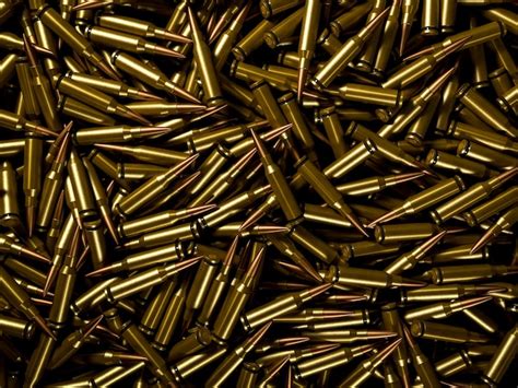 Premium Photo Closeup Background Of Pile Of Polished Rifle Bullets