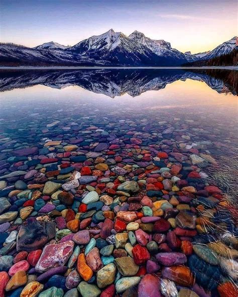 The colorful rocks of Lake McDonald in Glacier National Park, Montana ...