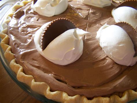Chocolate cream pie with a peanut butter pie dough and a whipped peanut butter cream. Chocolate Cream Pie With Peanut Butter Cups