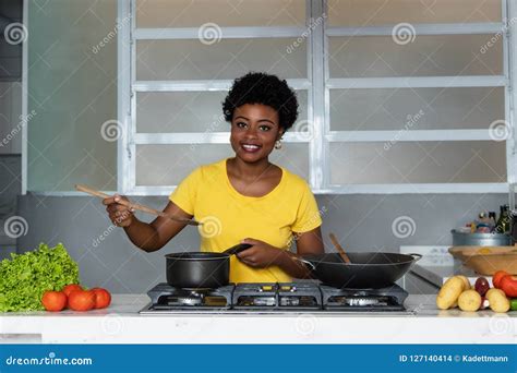 African American Woman Enjoys Cooking Healthy Food Stock Photo Image