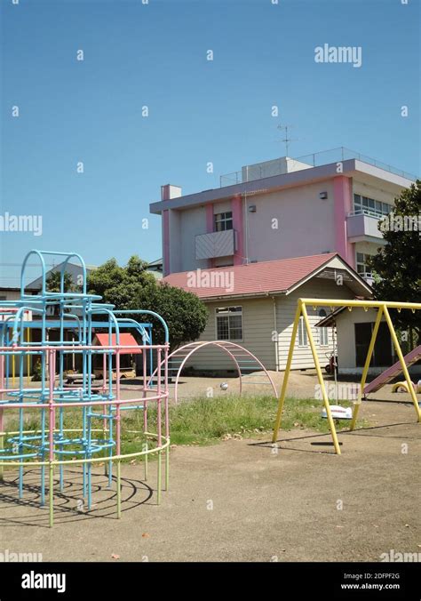 A Traditional Japanese Elementary School Playground With A Slide Swing