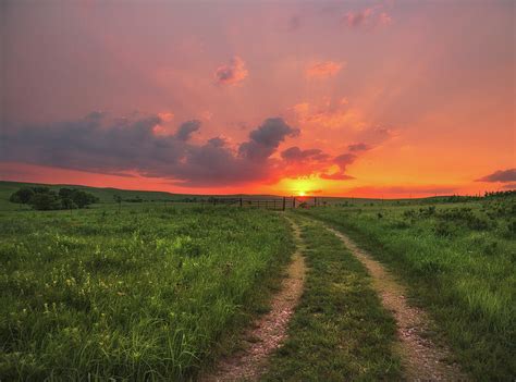 I have been dirt biking for years and am trying to pass the sport on to my son. Ride Off Into The Sunset Photograph by Darren White