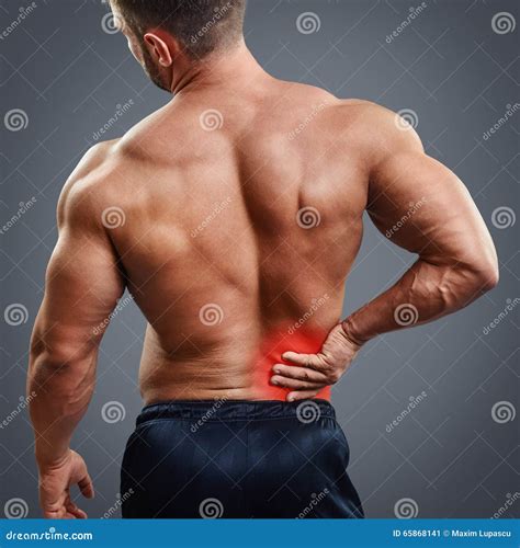 Dor Nas Costas Do Homem Do Músculo De Ahtletic Imagem de Stock Imagem