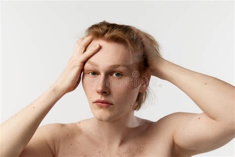 Portrait Of Young Redhead Man Posing Shirtless Doing Hairstyle After