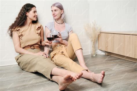 premium photo lesbians drinking wine