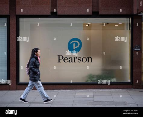Commuters Walking Past Pearson Education Company Headquarters In