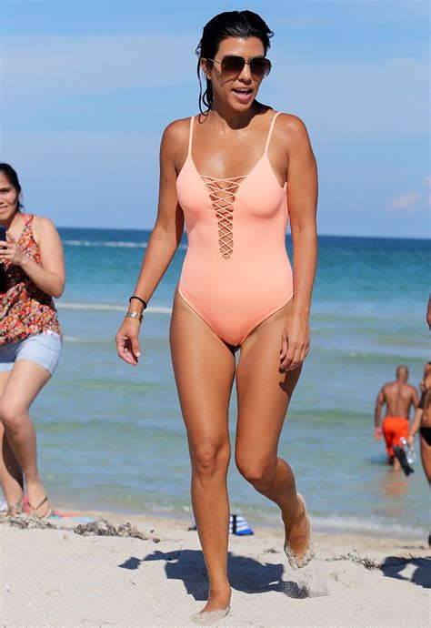 Kourtney Kardashian Shows Off Her Toned Bum In A Cheeky Pink Bathing Suit