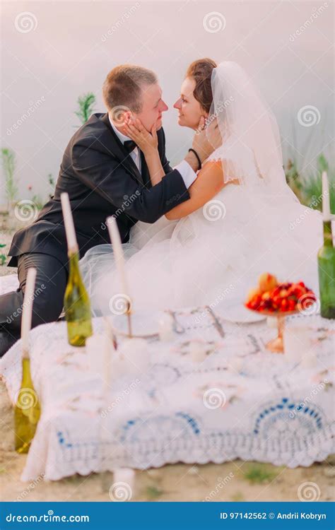 The Sensitive Side Portrait Of The Newlyweds Petting Each Other Faces