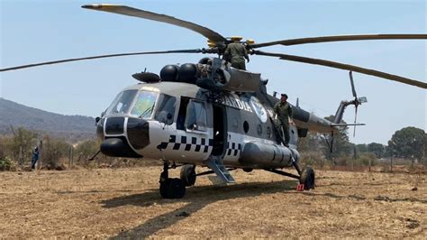 con helicóptero de la gn combaten incendio forestal en morelia el heraldo de méxico