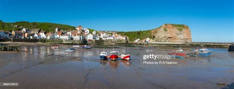 Low Tide At Staithes Harbour North Yorkshire England High Res Stock