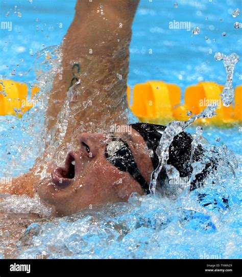 usa s ryan lochte glides through the water during the backstroke on his way to a gold medal in