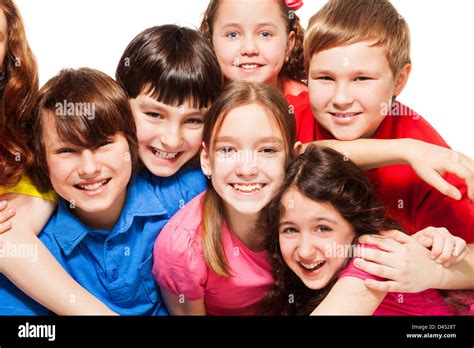 Close Up Of A Group Of 10 Years Old Kids Boys And Girls Hugging