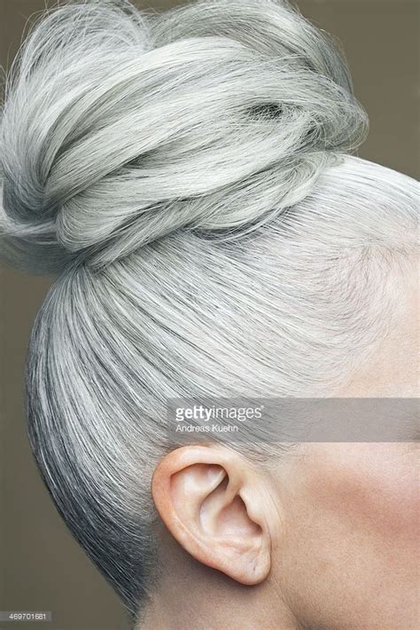 Stock Photo Cropped Image Of A Grey Haired Bun Long White Hair