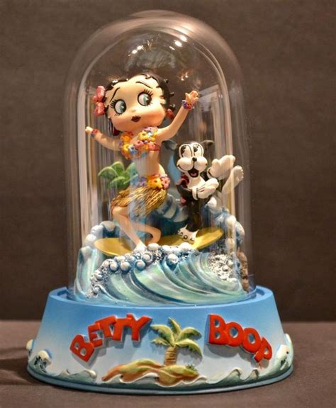A Toy Figurine Under A Glass Dome With The Words Betty Boo On It