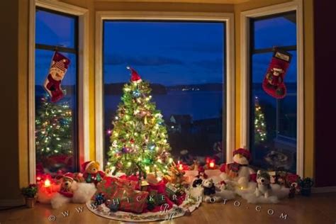 Photo Of A Christmas Scene With A Decorated Tree And Stockings Hanging