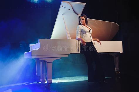 The Woman With White Piano Beautiful Pianist On The Stage Near The
