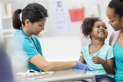 Pediatrician Examines Young African American Girl Harbor Health Services