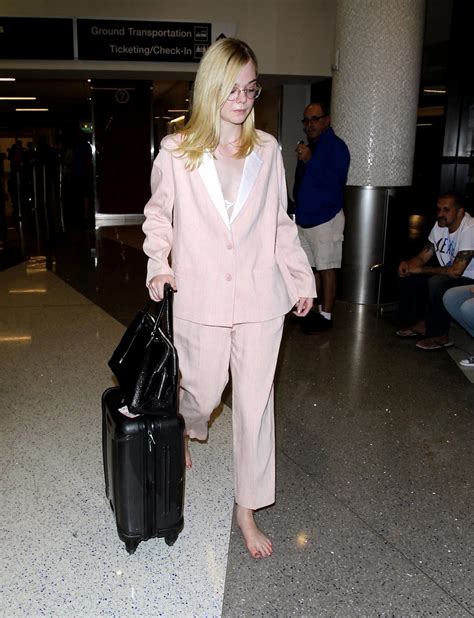 Elle Fanning Went To The Airport Barefoot Which Is Something