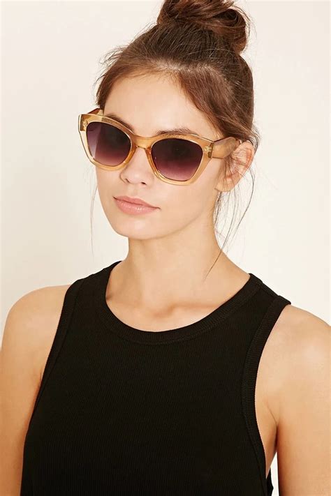 A Pair Of Oversized Cat Eye Sunglasses Featuring Gradient Lenses And Clear Frames Accessorize