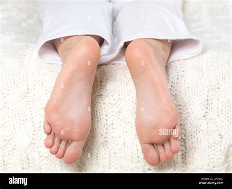 Closeup Of Bare Feet Soles Of A Woman Lying On A Bed Stock Photo Alamy