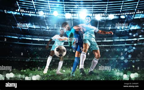 Close Up Of A Football Action Scene With Competing Soccer Players At
