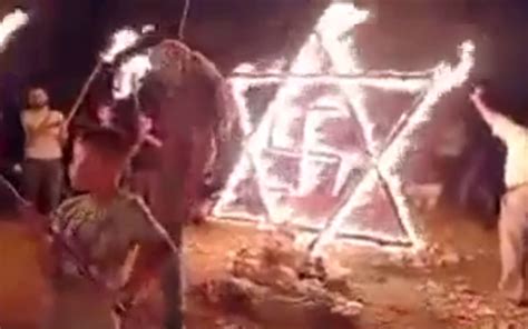 With Flaming Star Of David And Swastika Palestinians Protest Illegal