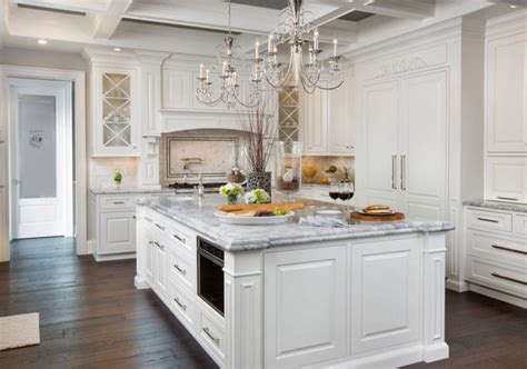 A combination of white painted cabinetry and rustic hickory cabinets create an earthy and bright kitchen. Beautiful White Kitchen Cabinets Ideas to Enlight Your Kitchen