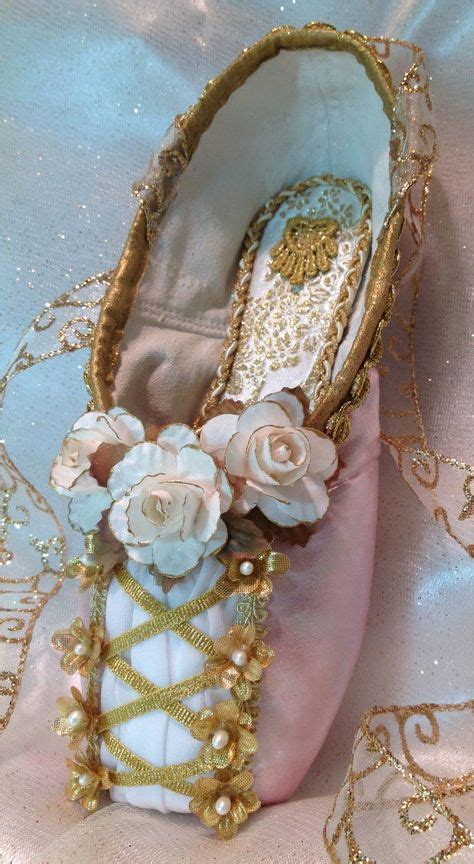 Pink And Gold Decorative Pointe Shoe Designed To Mimic The Lace Up