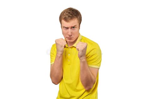 Angry Young Man In Yellow T Shirt Ready To Fight With Fists Isolated On