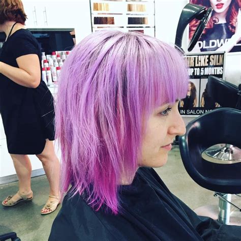 Hairstylist that specializes in womens cuts, balayage, color, men's cuts, bridal hair and deva curly hair. This amazing soft pastel violet with purple was created ...
