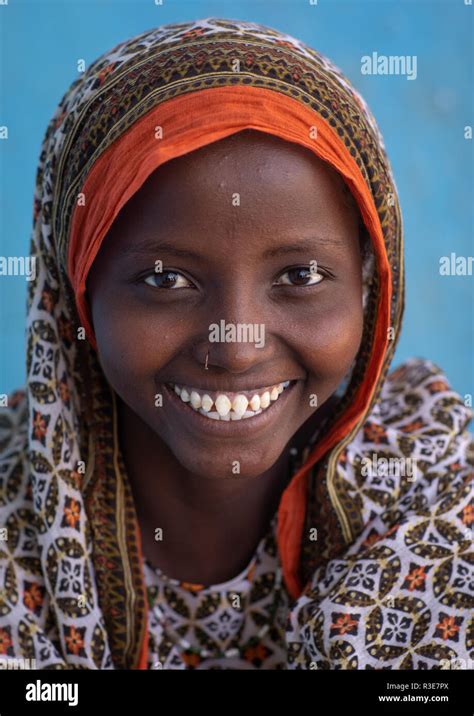 Portrait Of A Veiled Smiling Afar Tribe Girl With Sharpened Teeth Afar
