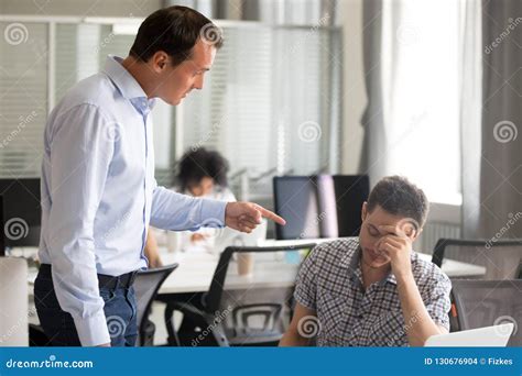 Angry Boss Scolding Rebuking Incompetent Male Office Worker At W Stock