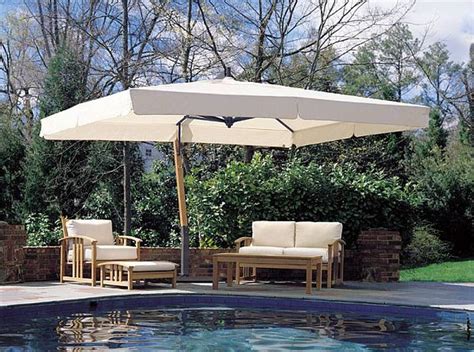 The canopy is supported from the side and above, which allows it to hang freely over a variety of seating and table configurations. Giant Rectangle Sidepost Umbrella, 10x13ft Offset Canopy - P19
