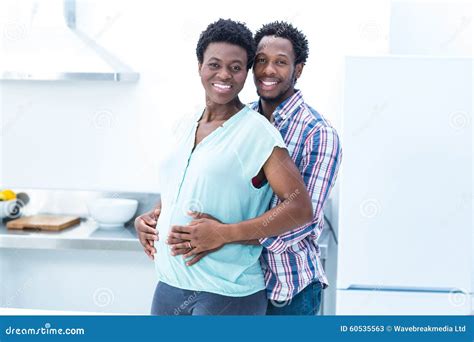 Portrait Of Man Embracing His Wife While Standing Stock Image Image