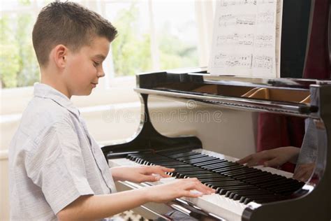 Boy Playing Piano Royalty Free Stock Image - Image: 6441456