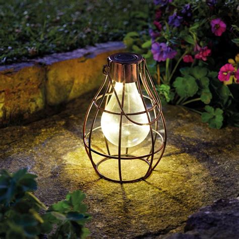 Garden lanterns also look good on an outdoor dining table or side table as a centrepiece, if you're struggling to find a space to work with them. Bright Garden Hanging Solar Eureka Firefly Lantern - Buy ...