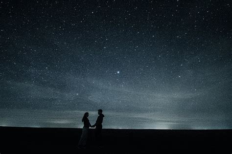 Royalty Free Photo Man And Man Holding Each Others Hands Under Starry