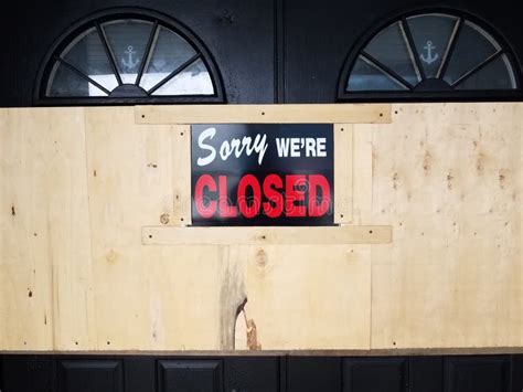 Sorry We Re Closed Sign On Door And Wooden Board Stock Image Image