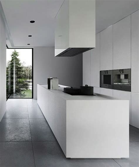 Pretty kitchen cabinets and drawers in white. 25 Minimalist Kitchens With Sleek And Edgy Designs ...