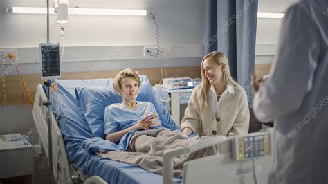 mother visiting son in hospital stock image f032 8909 science photo library