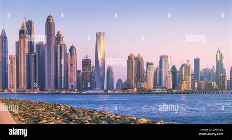 Modern Buildings With Gold Reflection Of Sunset On Dubai Marina Bay