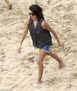 penelope cruz shows off stunning figure in red swimsuit on spanish beach daily mail online