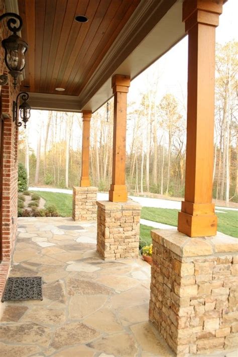Front porch modern farmhouse porch modern farmhouse porch features board and batten siding, brick flooring, gas copper lanterns and cedar ceiling screened porch outdoor living is made easy no matter the season with this spacious screened in porch screened porch flooring screened porch. Western Red Cedar 8x8 Beams used for the columns and V ...