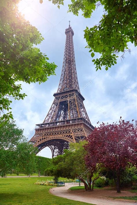 View Of The Eiffel Tower Through The Trees Of The Park Stock Photo By