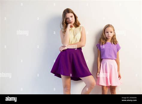 Two Fashionable Little Sister Girls Of Different Ages Stock Photo Alamy